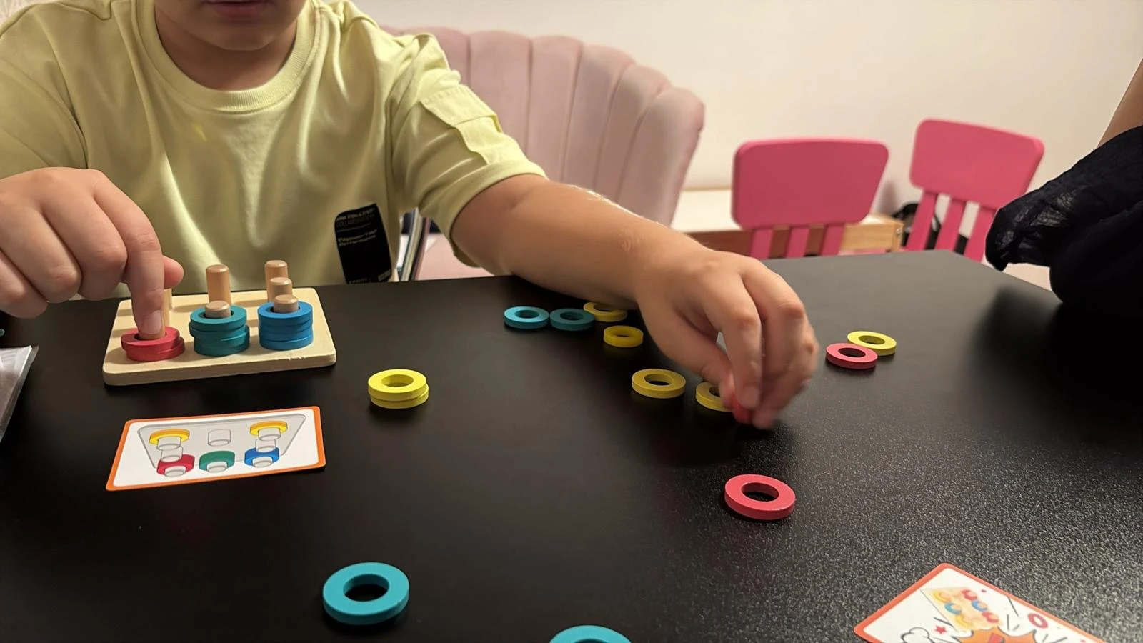 Alex learning with colorful toys